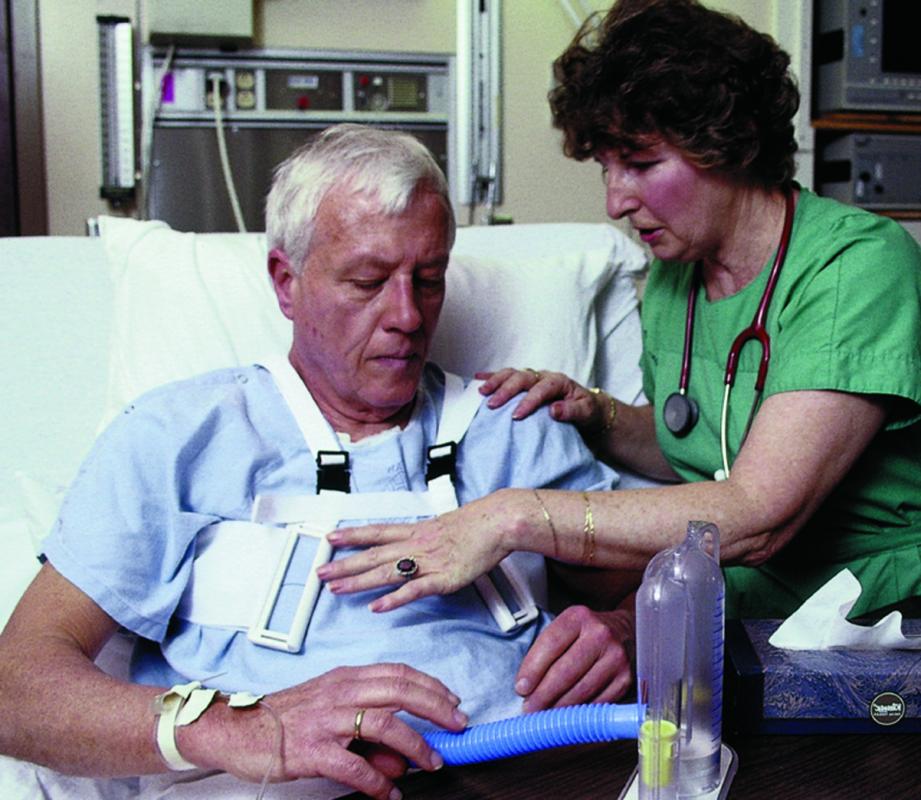 Nurse helping man put on Heart Hugger