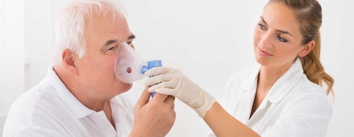 Nurse Helps Patient with Oxygen Mask